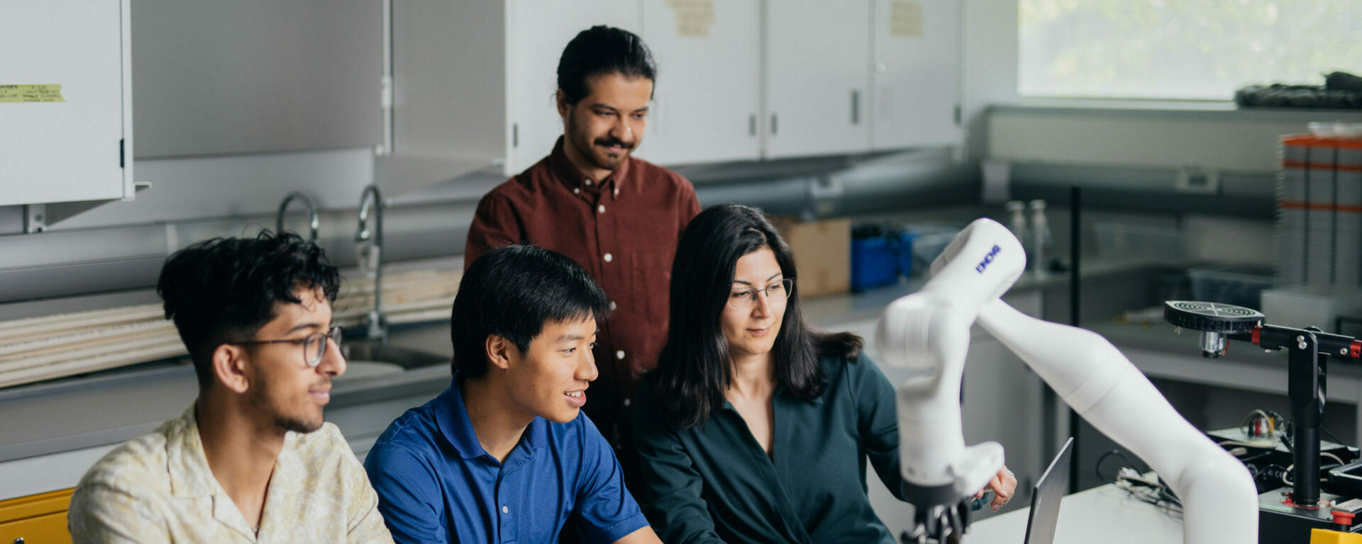 Dr.Bisheban Demonstrating the use of a Robotic Arm