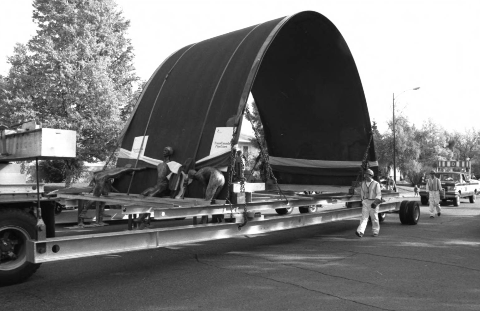 Image of a truck hauling the Olympic Arch, designed by Toronto architect Jack Diamond, to the University of Calgary after it had been on display at city hall following the 1988 Calgary Winter Olympics. Image of a truck hauling the Olympic Arch, designed by Toronto architect Jack Diamond, to the University of Calgary after it had been on display at city hall following the 1988 Calgary Winter Olympics.