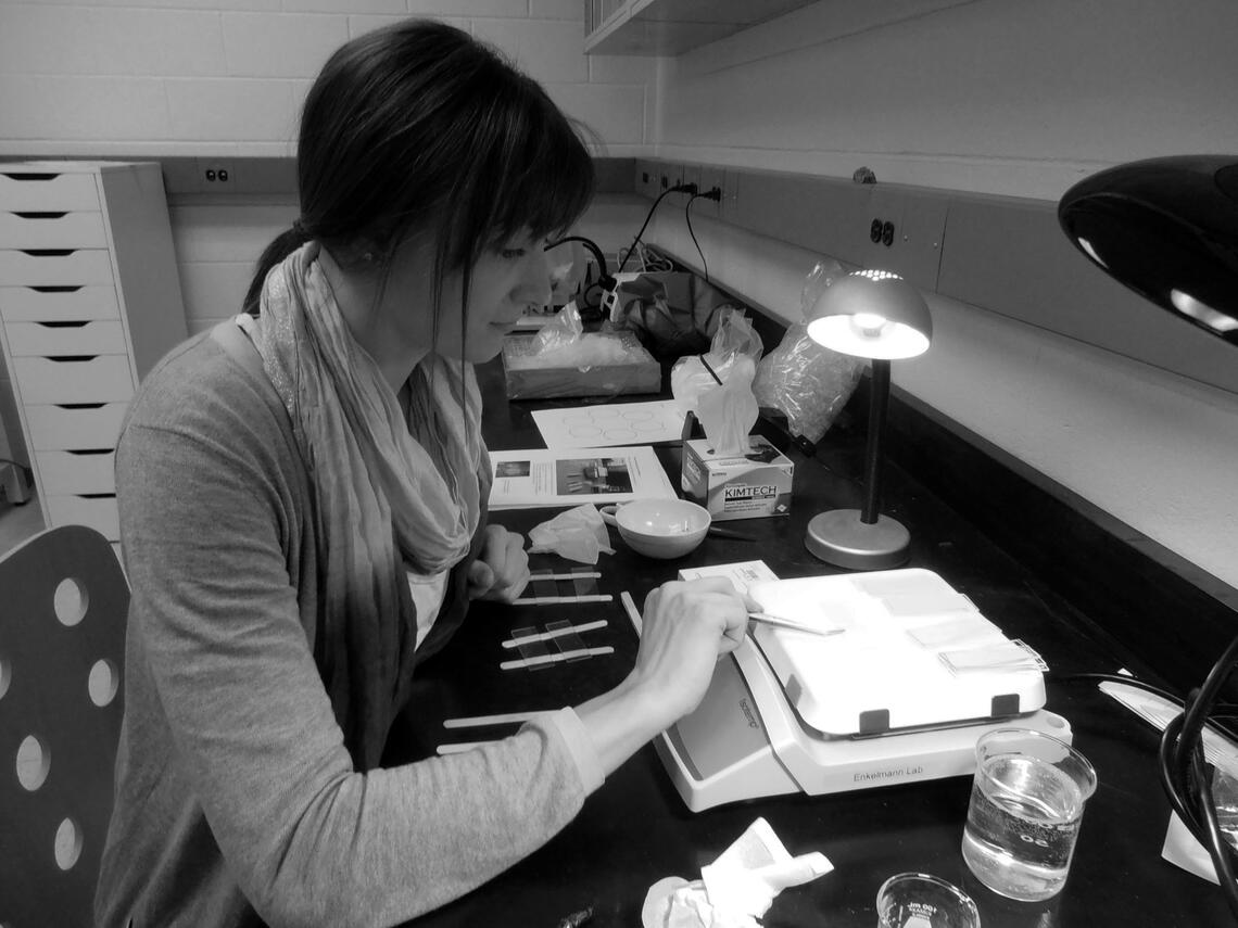 A student makes zircon fission track mounts using a hotplate, glass slides, and a popsicle stick