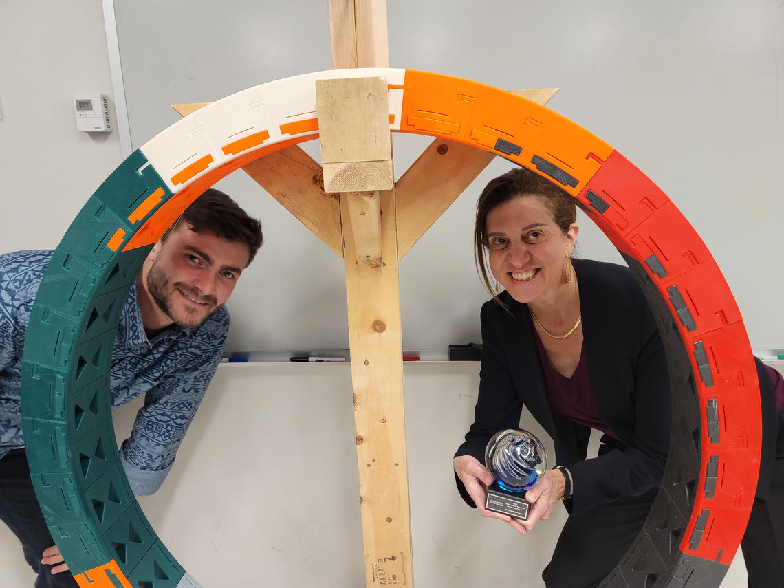 Lab Member Oliver and Dr. Yadid-Pecht Posed behind a ELF RF detector. 