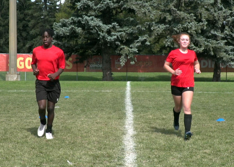 Soccer athletes jogging forward