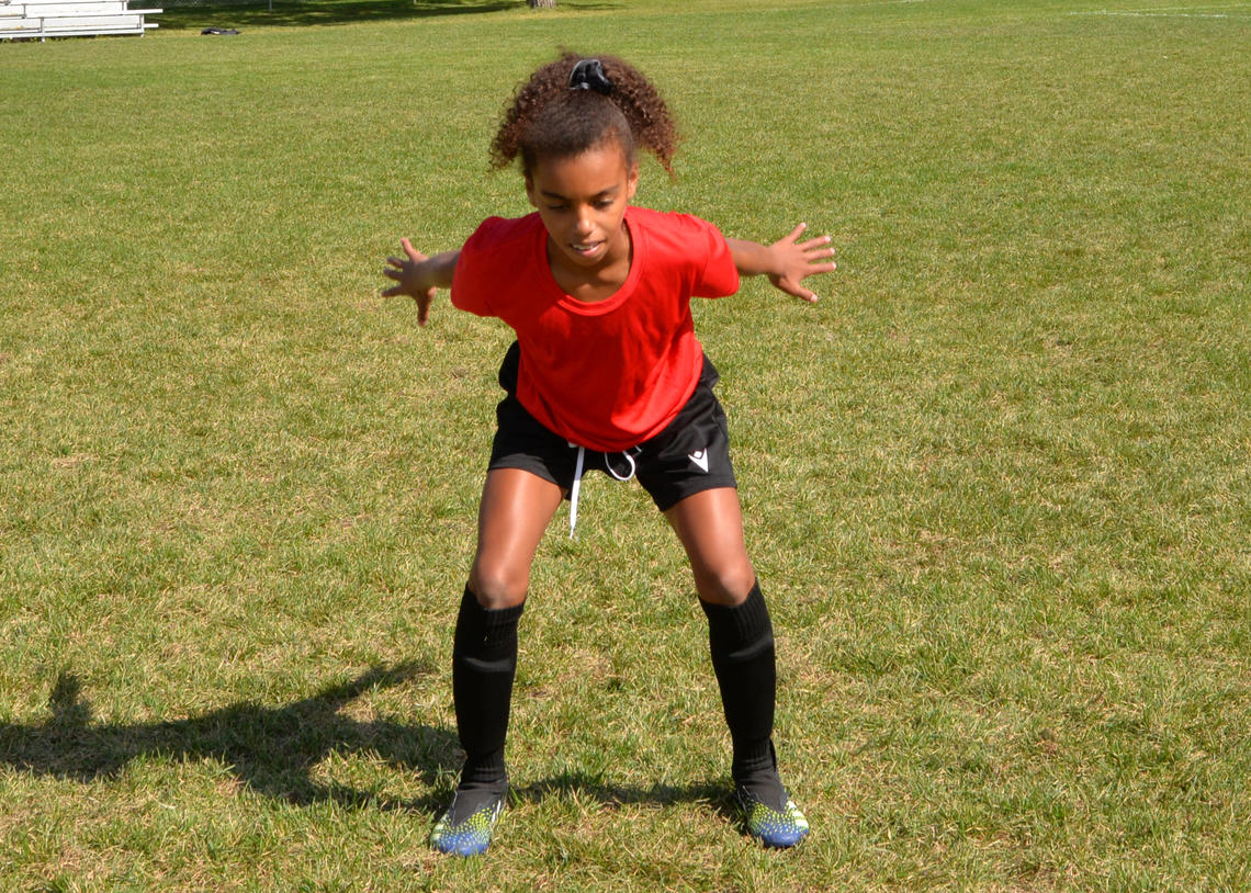 Soccer player performing a jump