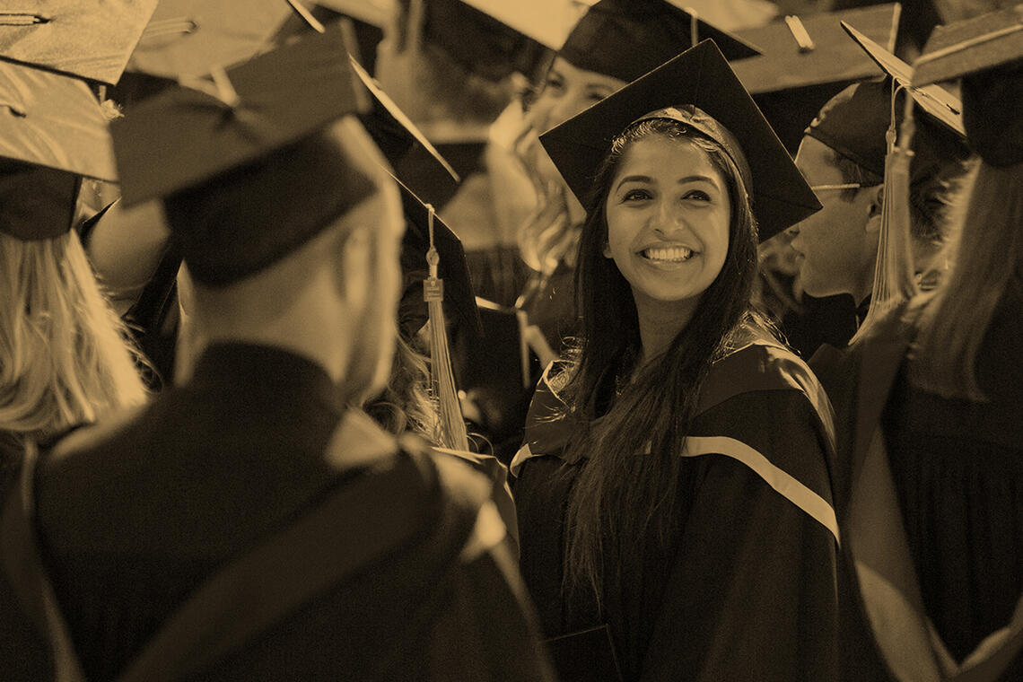 Gold overlay photograph of a UCalgary graduate.