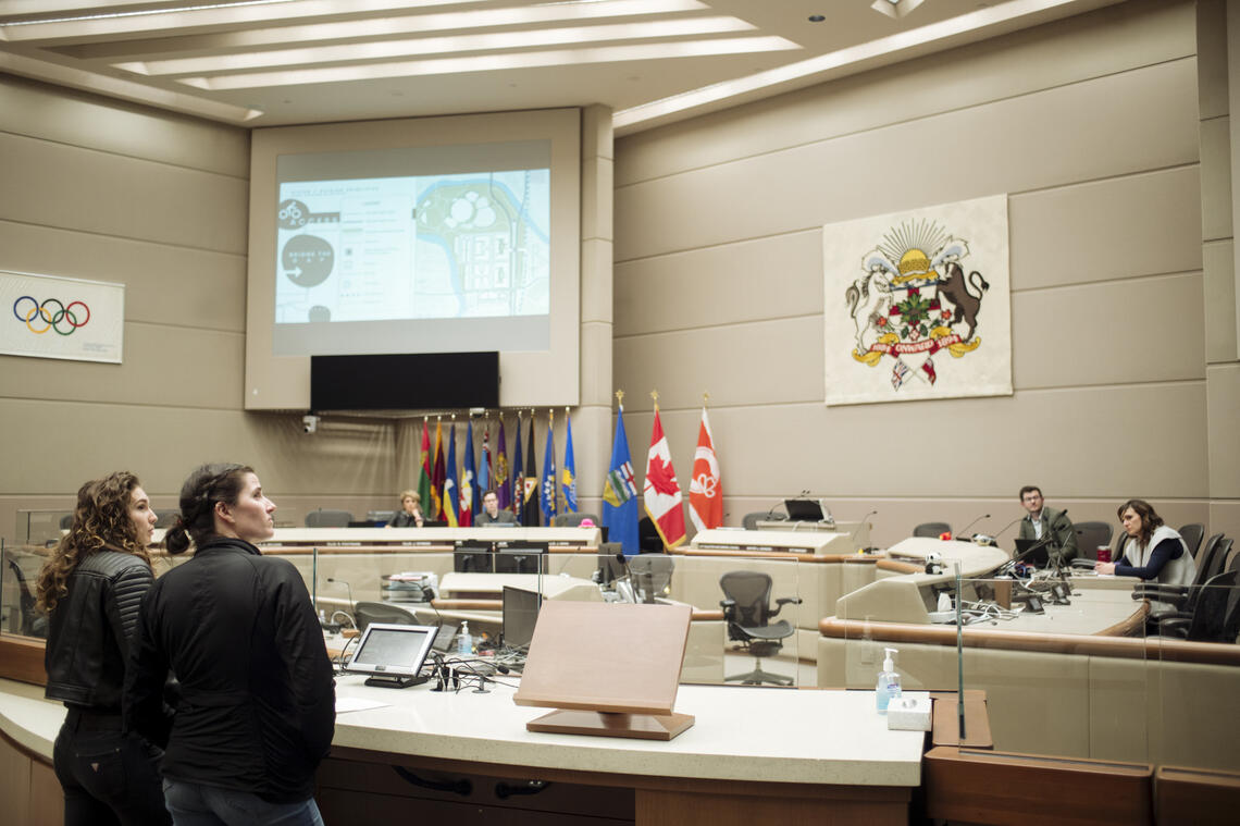 Two students present an urban studies project at Calgary city hall.