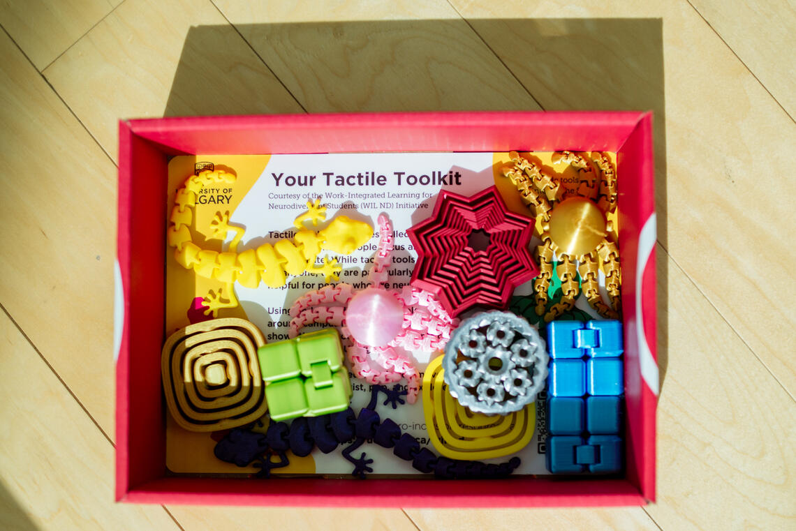 A variety of tactile tools contained in a tactile toolkit box