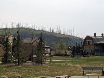 Historic homes and a ship steam engine on display at Heritage Village in Fort McMurray. 