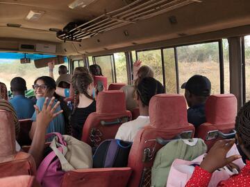 UCalgary and MUST students riding a bus