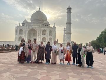 Students dressed in traditional clothes outside the Taj Mahal