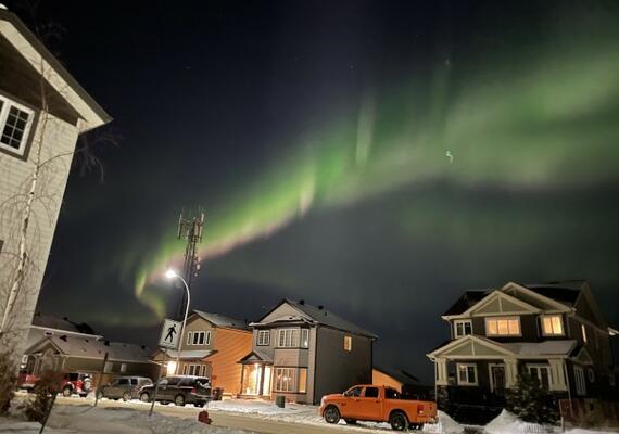 Northern lights above a suburban neighbourhood