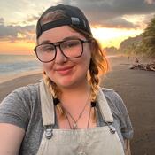 Selfie of a student on a sandy beach