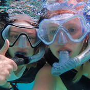 Selfie of two students in snorkel masks underwater