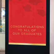 Red sign on a digital billboard congradulating graduates