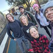 Family posing together, photo taken as a selfie on an angle