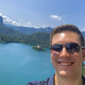 Selfie of a student overlooking a very blue lake