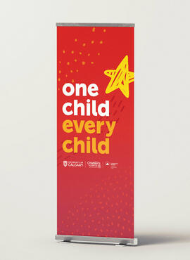 A red graphic pull-up banner for events
