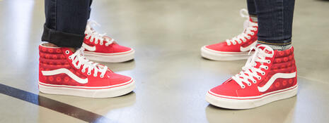 Two sets of red sneakers 