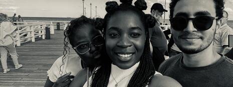 Black and white photo of two students on a pier