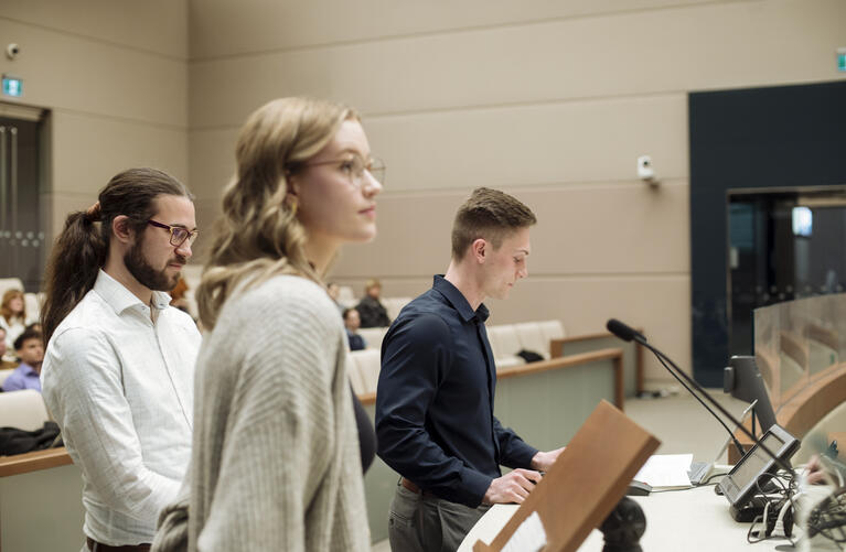 Students present a project at Calgary City Hall.