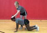 Rugby athletes performing Bear Crawl Bobbleheads exercise