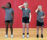 Female rugby athletes performing static neck contractions