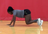 Athlete performing multidirectional bear crawl exercise