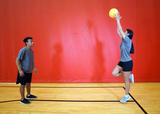 Single-leg balance with squat pass and jump catch