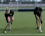 Athletes performing stick handling while balancing on single leg