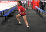 Athlete performing 4-D lunge exercise in an ice hockey arena
