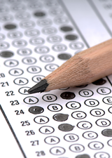 pencil resting on an exam answer sheet