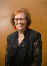 A portrait photograph of Aritha Van Herk
