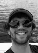 Aaron on a boat in a lake