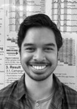 Momo in front of a scientific poster