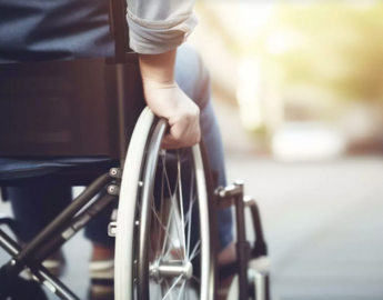 photo of person pushing themselves in wheelchair 