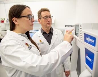 Kerri and Mike operating the microwave digestion unit