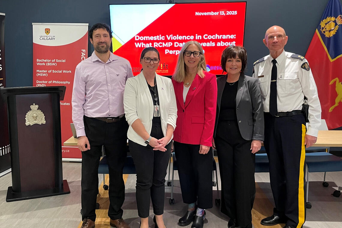 A group of people stand together