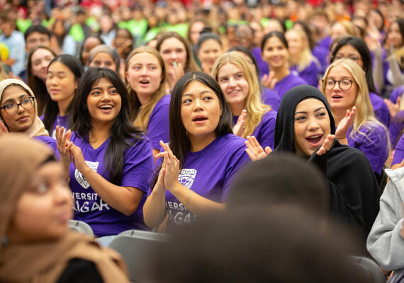 A group of students clapping